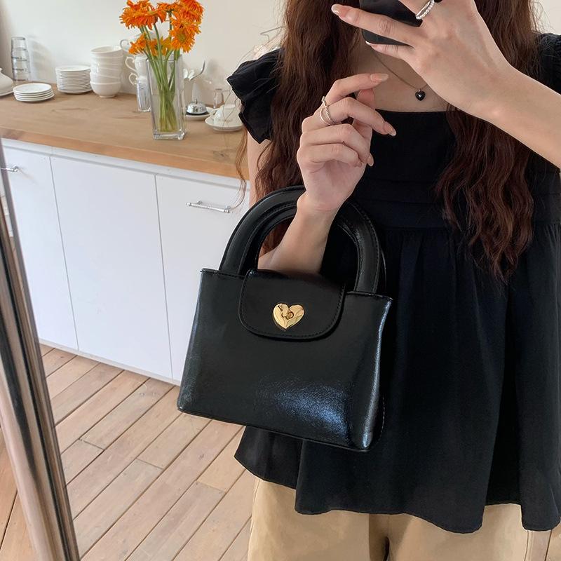 Korean Niche Love Lock Handbag Ins Women's Bag Texture Quality Casual and Durable Material Fashionable One-shoulder Cross-slide Bag