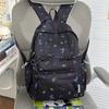 Cute Bow Tie Print School Backpack Lightweight Nylon Zipper Daypack with Front Pocket for Teen Girls Daily Travel