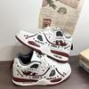 2025 Retro Graffiti Luftkudde Sneakers: Mångsidiga och trendiga vardagsskor för sport för män