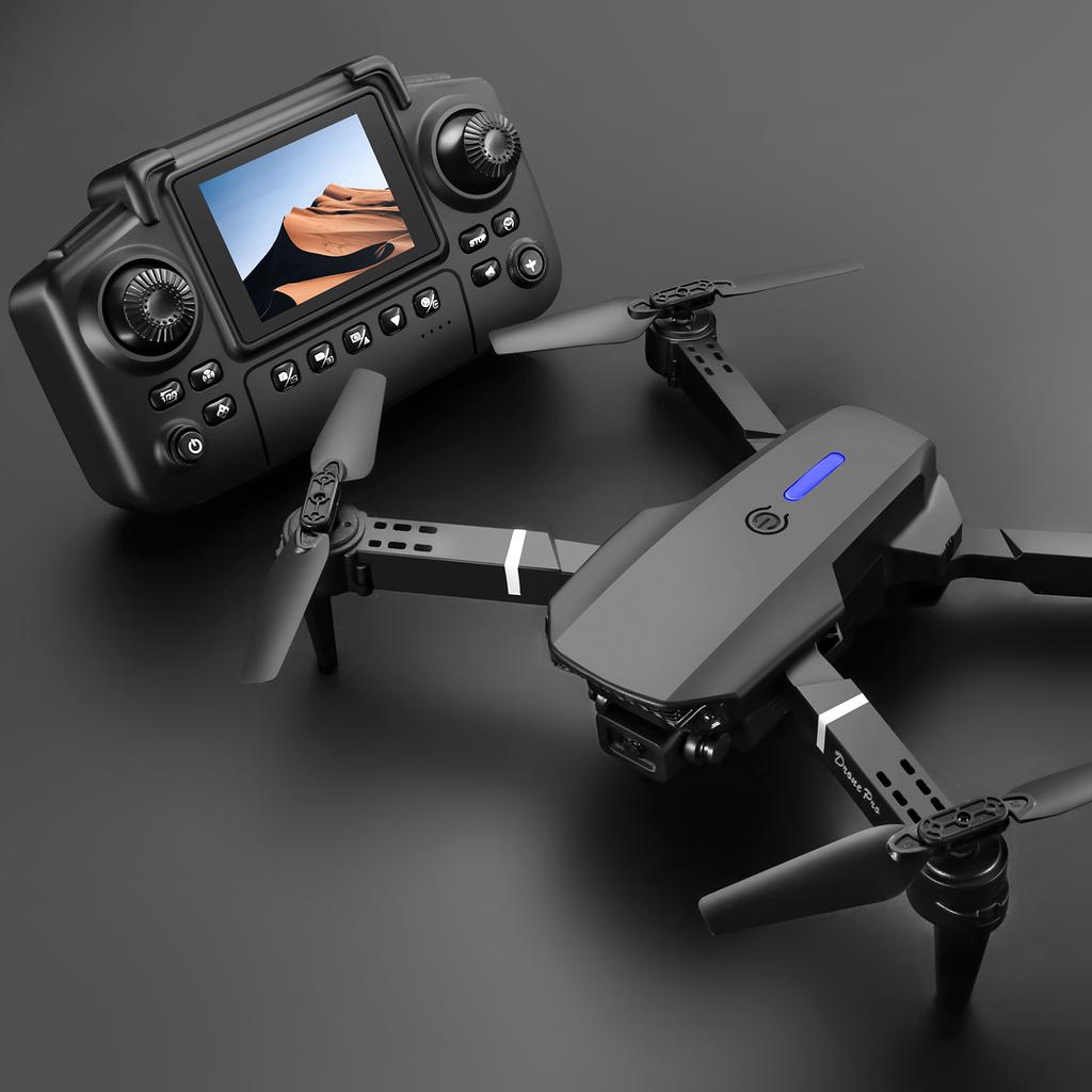 NUOVO Drone E88 Controllato da Schermo Telecomando con Display Quadricottero Flusso Ottico Doppia Fotocamera Aereo per Fotografia Aerea