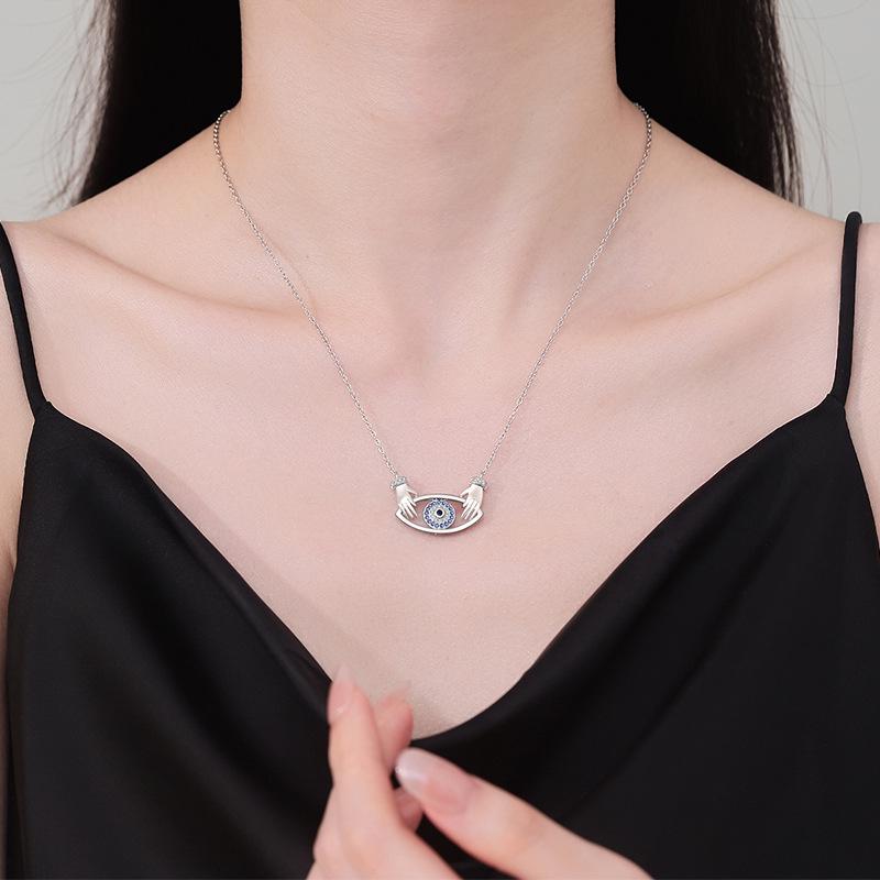 Elegant Devil's Eye Pendant Necklace for Women - European & American Fashion, Double Hand Hug Design, High-End Clavicle Chain