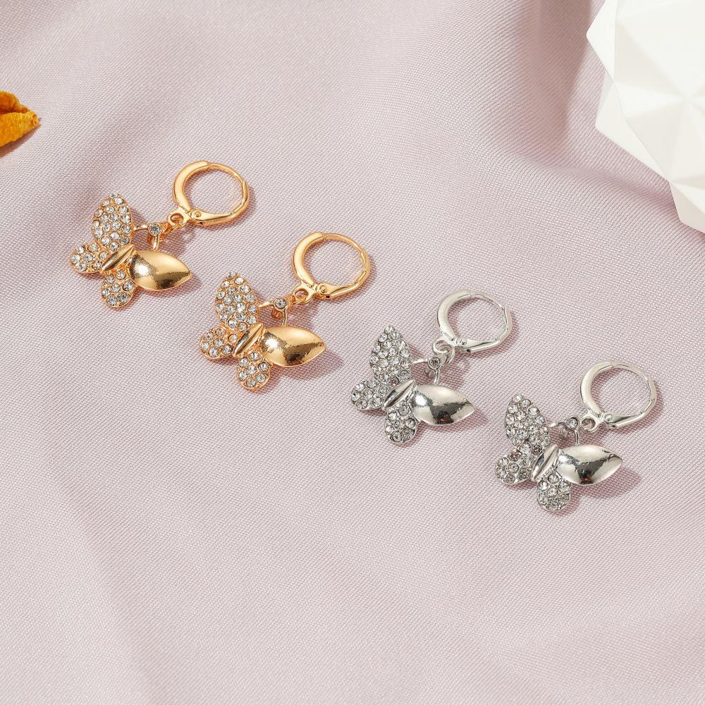 Fargerike sommerfugløreringer for kvinner - Stilig og kreativ nisjedesign med diamantaksenter