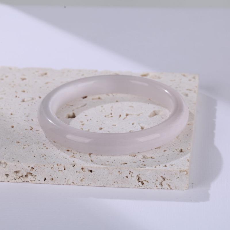 Bransoletka Bangle w kolorze szampańskiego złota i brzoskwiniowego różu z efektem kociego oka: Gradientowy wzór białego światła księżyca