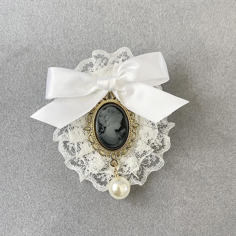 Elegant Lace Bow Brooch with Pearl Embellishment