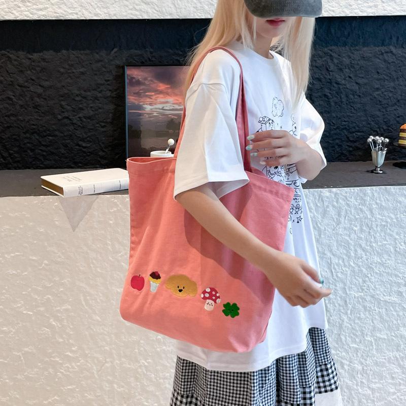 Casual canvas bag design sense niche women's bag 2025 new cartoon printed tote bag large capacity shoulder bag