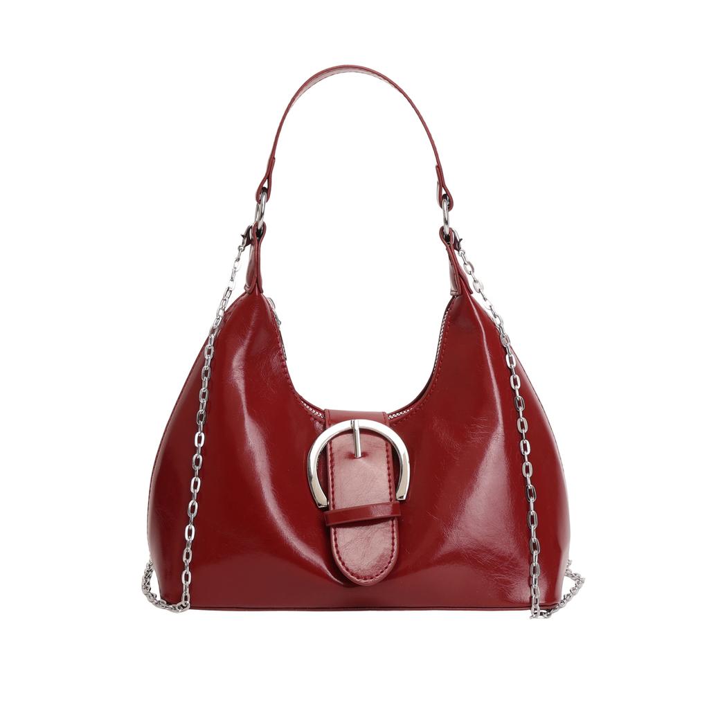 Solid color crescent-shaped hobo bag with metal D-ring embellishment, elegant underarm bag, versatile women's handbag for dates and everyday wear.