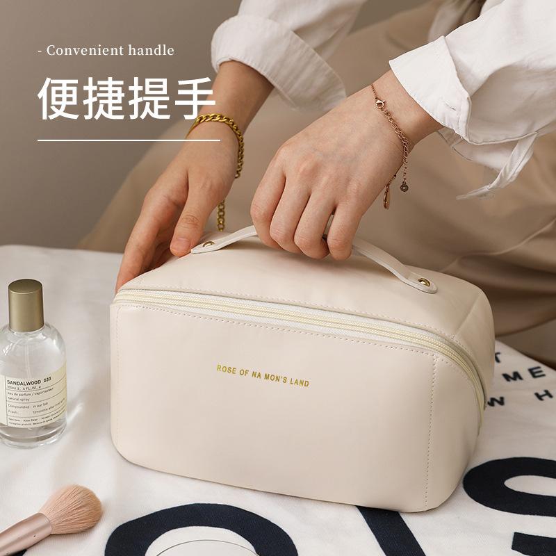 New high-value versatile simple cosmetic bag large-capacity portable leisure high-end feeling new travel products toilet bag бежевый
