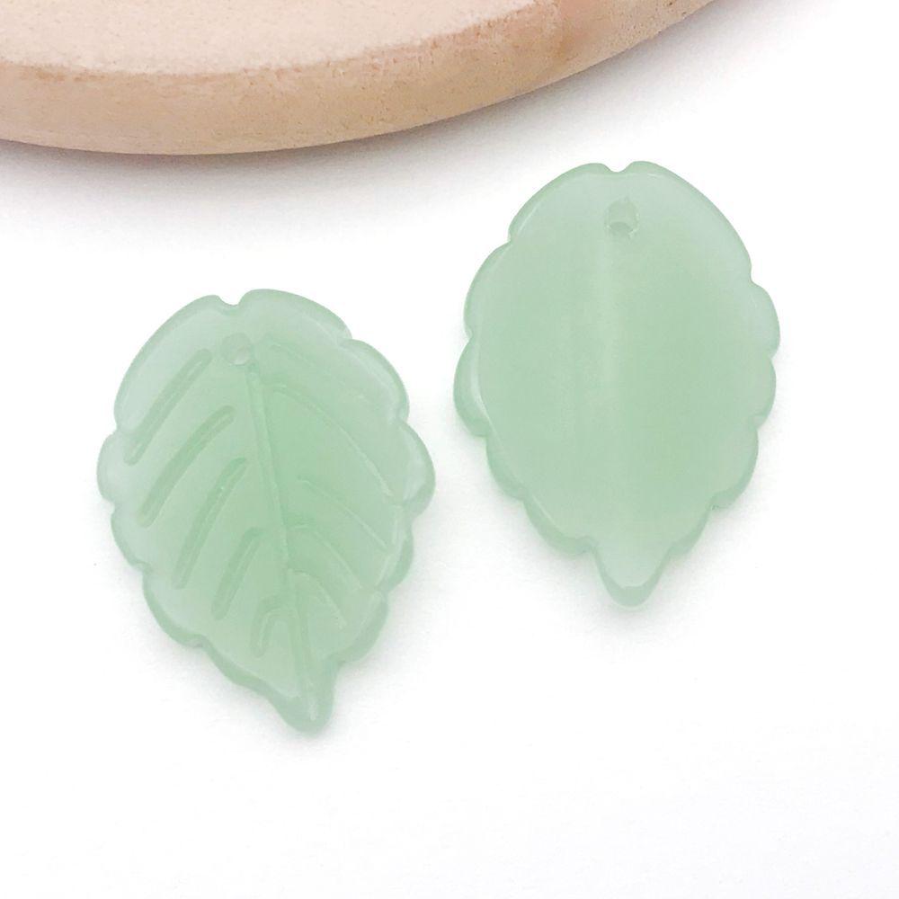 Set of 20 Green Transparent Faux Glass Leaf Pendants for DIY Bracelets, Necklaces, and Video Accessories.
