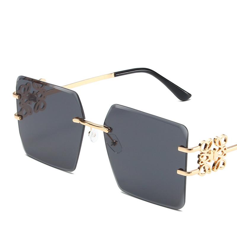 Damenbrille Sonnenschutz UV-Schutz Mode Persönlichkeit Retro Künstlerische Straßenaufnahme Konkave Form Reise Chinesischer Knoten Randlose Sonnenbrille