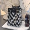 Versatile Large Knitted Handbag with Hollow-Out Flower Pattern