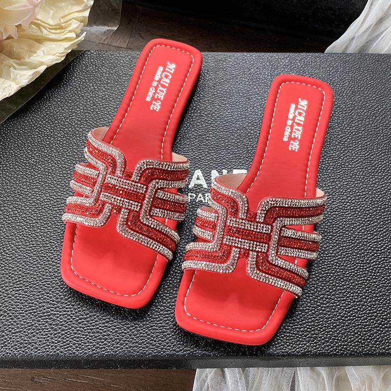 

Korean version of rhinestone slippers 2025 summer new large size flat bottom women s casual low heel one word sandals beach shoes 44