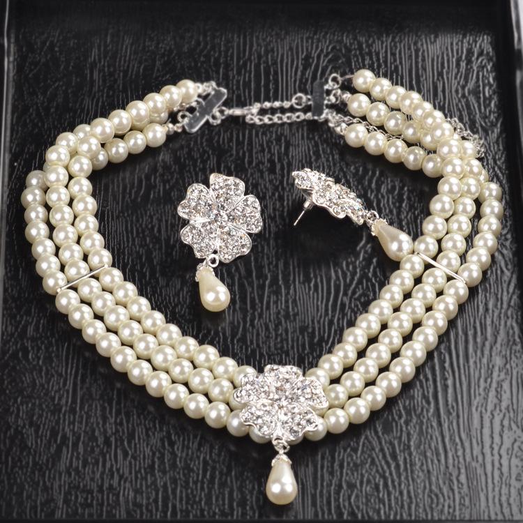 

Свадебный комплект из четырехрядного жемчужного ожерелья и серег - Свадебные и вечерние аксессуары