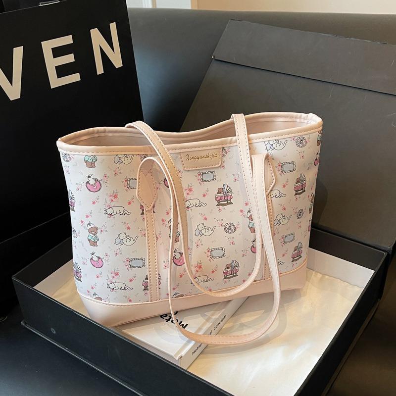 

Large-capacity commuter handbag bag spring and summer new fashion shoulder bag printed cartoon underarm tote bag women рожевий