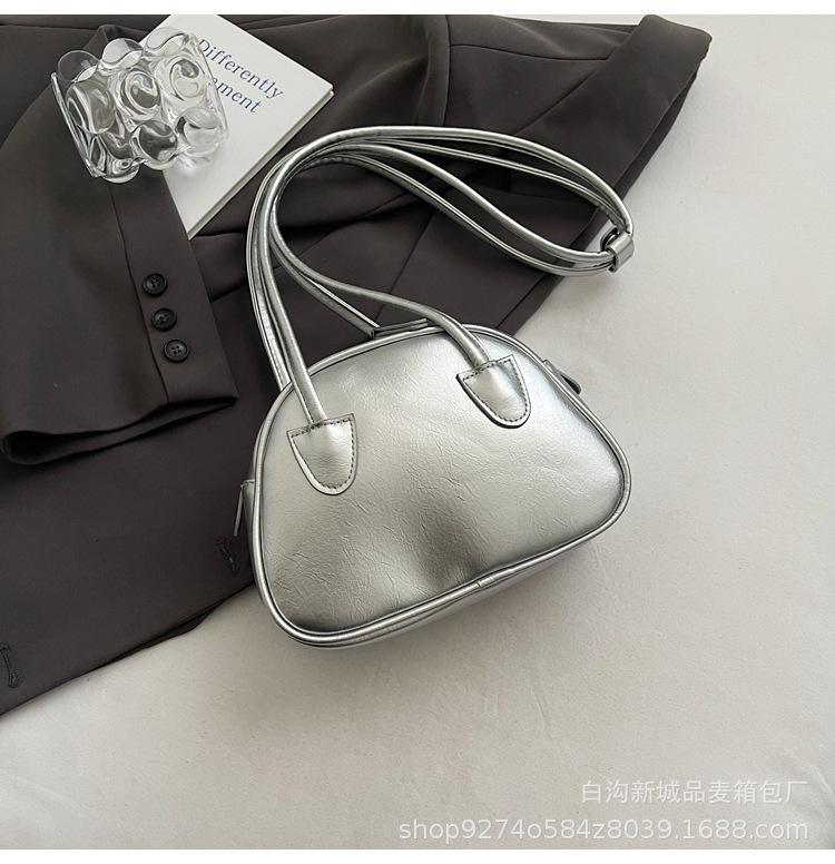 

Korean version of sweet style niche bowling handbag bag women s tide texture simple contrasting color shoulder bag fashion messenger bag серебряный