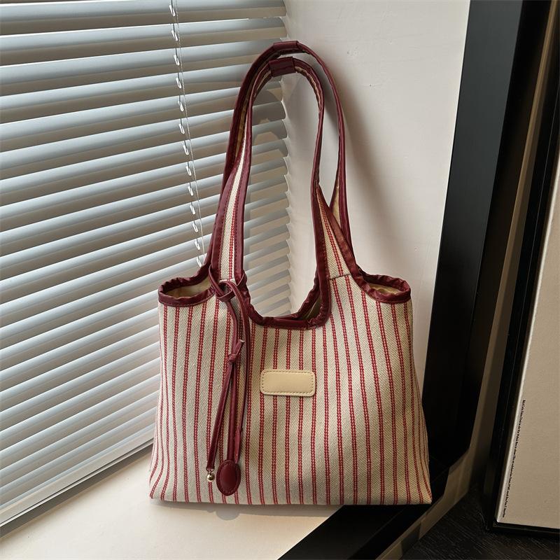 2025 New Niche Shoulder Bag Striped Simple Tote Bag Simple Versatile Portable Color Matching Armpit Bag