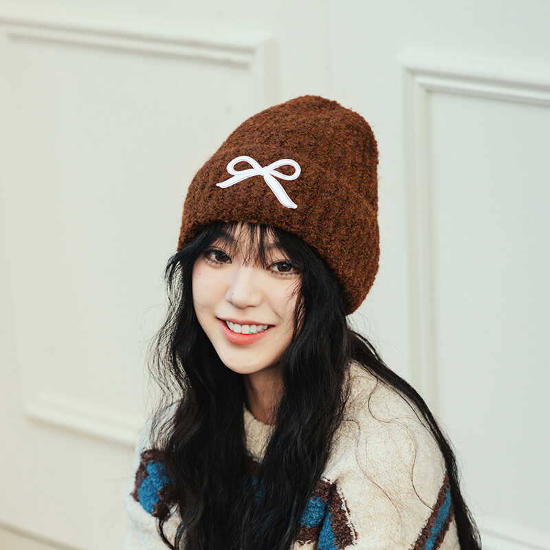 Hat women's autumn and winter wool hat new cute bow versatile cold hat ear protection warm knitted hat tide