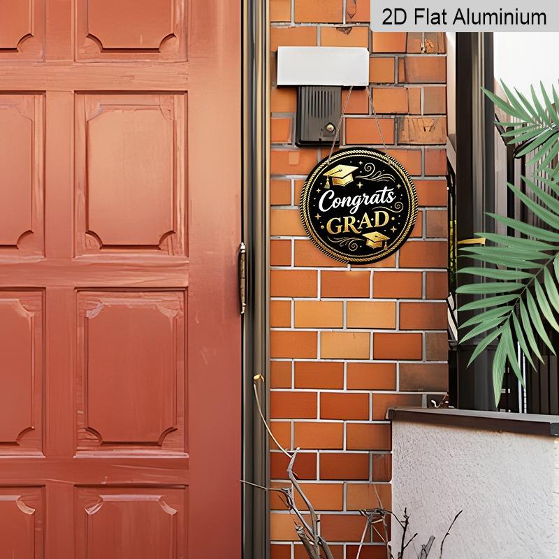 2D Flat Aluminum Graduation-themed Wall Decoration Available in Multiple Sizes Features A Black and Gold Minimalist Graduation Cap Design Making It A