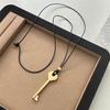 Elegant Metal Key Charm Black Rope Necklace Stylish Layering Pieces For Everyday Wear