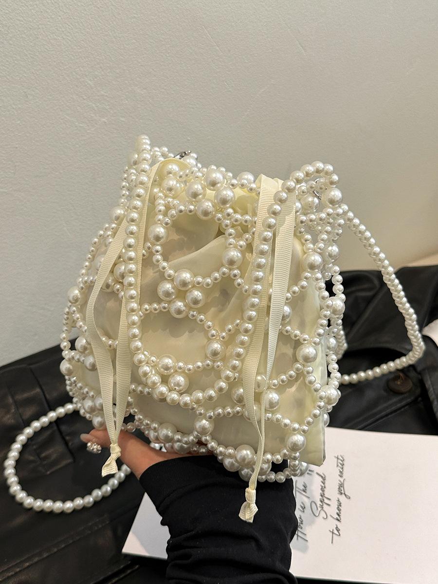 

Tote bag Internet celebrity bag women 2025 new niche factory direct sales hand-woven bag portable niche hollow pearl bag белый