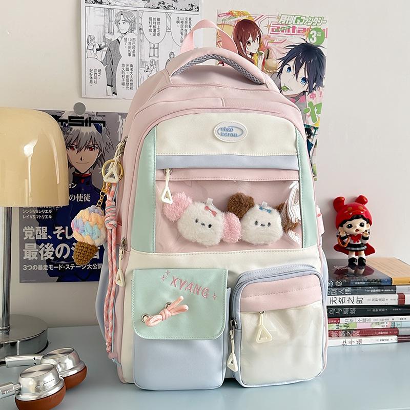 The new schoolbag is high-value, fresh and sweet, contrasting colors, splicing, and early high school students' lightweight travel backpack.