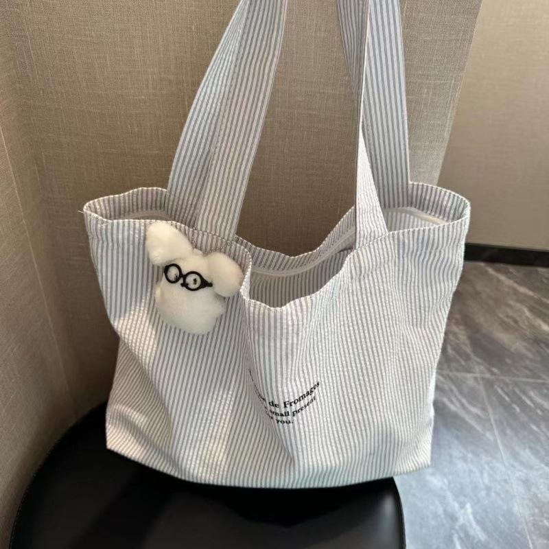 The new casual stripe is lazy and simple, and the large-capacity 2025 canvas bag is versatile and can be worn on one shoulder tote