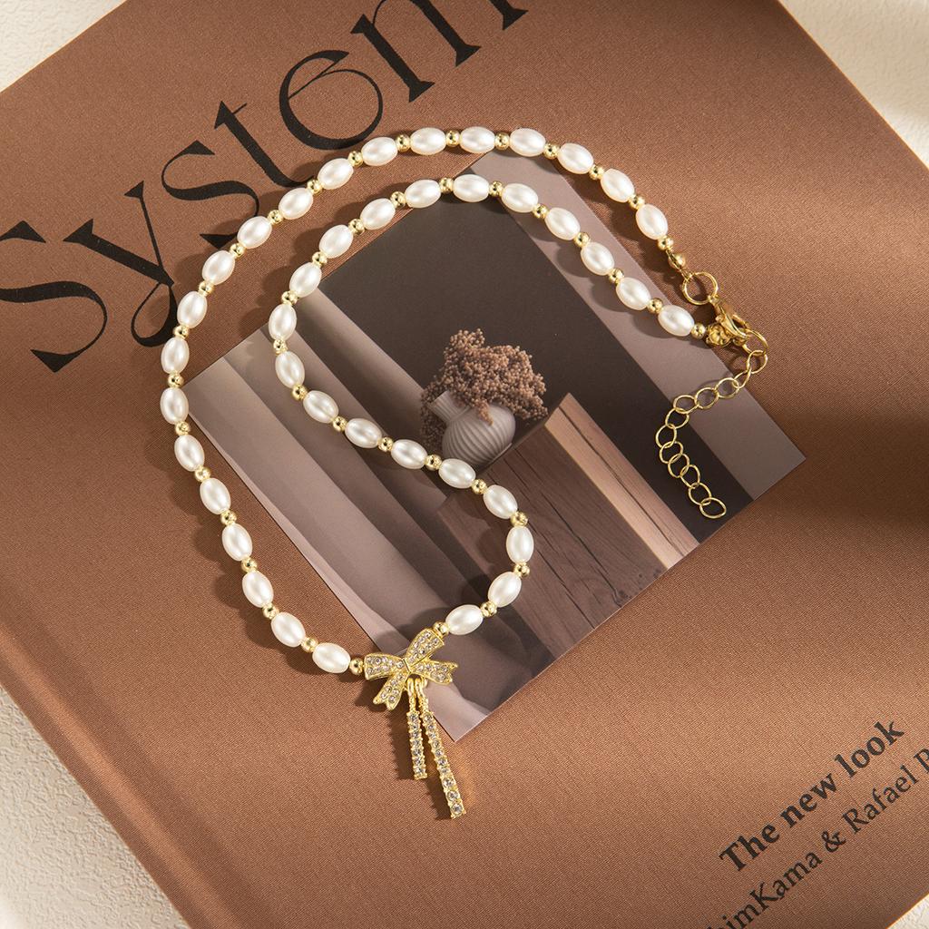 New freshwater pearl necklace personalized zircon bow necklace retro collarbone chain design female