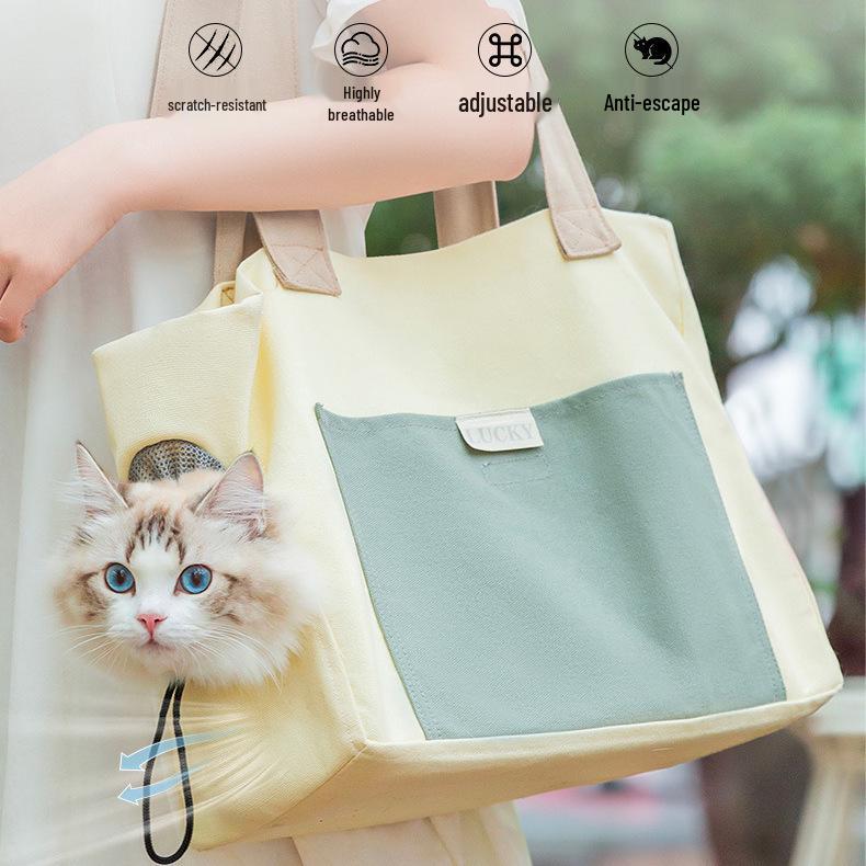 Portable Canvas Dog & Cat Carrier: Crossbody, Breathable, Head-Out Design for Small Pets.