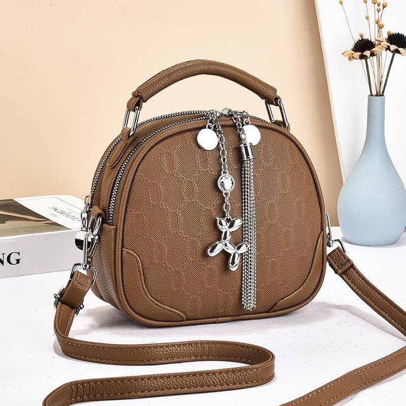 Simple and fashionable single shoulder portable messenger bag autumn and winter exquisite small round bag women's multi-layer fringed bag