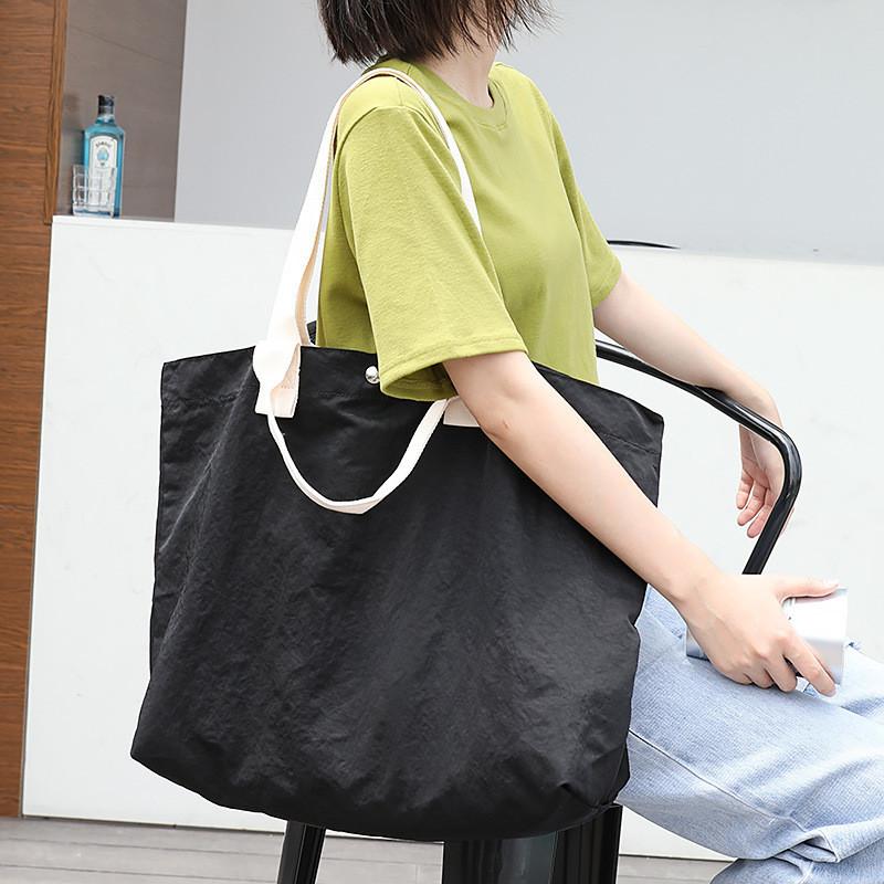 IELGY Korean version of casual large-capacity nylon handbag, simple literary Mori canvas bag