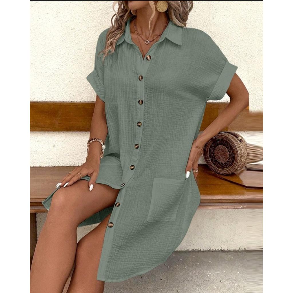 A Simple White Shirt Skirt, Made of Breathable Cotton, with A Streamlined Collar Design and Orderly Button Arrangement, Adding A Vintage Charm