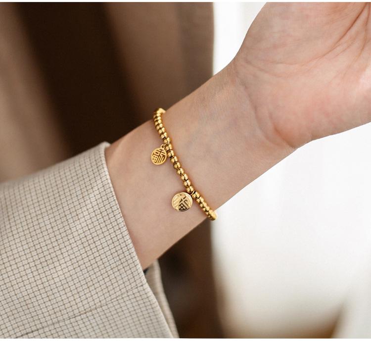 Japonsko-korejský 3D náramek z titanové oceli se zlatými postavami Fu a Xi a tykví - Jednoduchý, elastický design