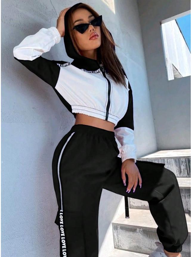 

Женский спортивный топ с цветными блоками и комплект очень длинных брюк S чёрный/белый