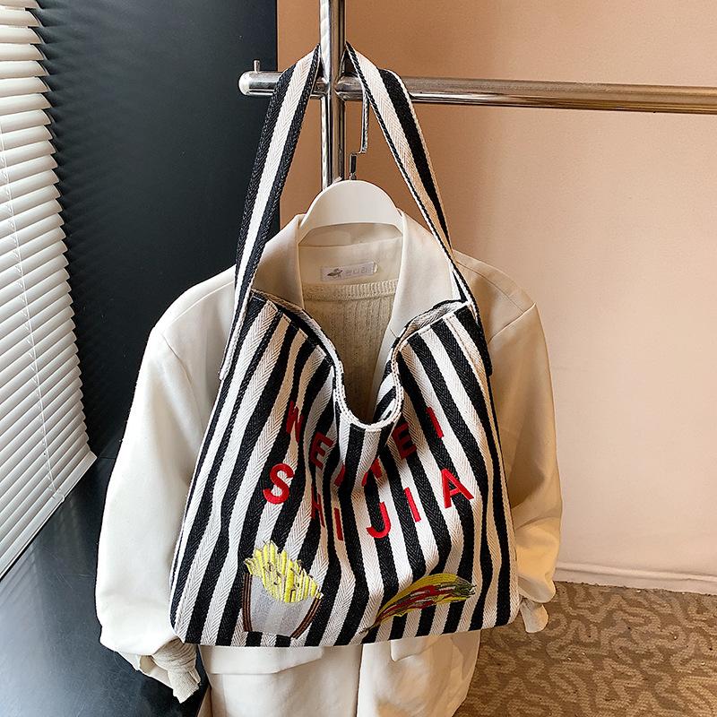 Korean casual lazy style canvas bag women's 2025 new large-capacity striped bucket bag fashionable shoulder bag
