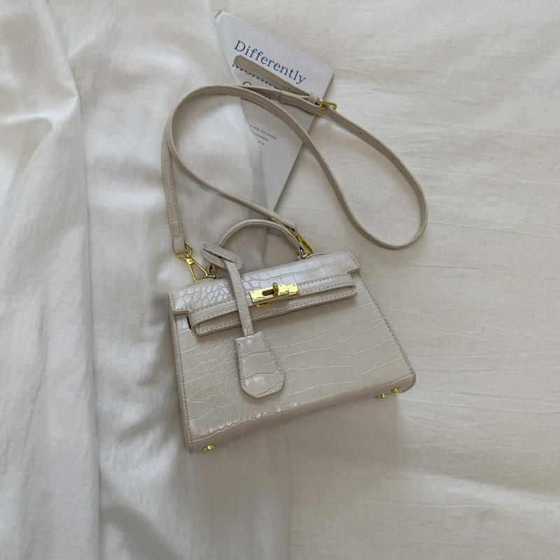 Korean version of fashionable niche stone pattern bag 2025 autumn new texture handbag retro fashion messenger bag bag