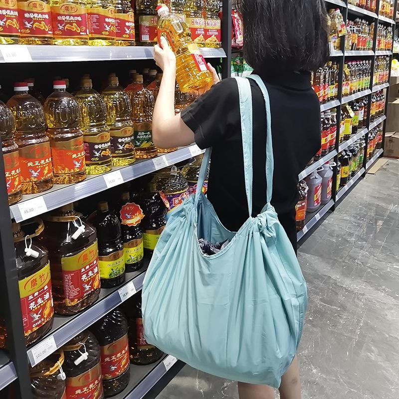 Eco-Friendly Foldable Shopping Tote with Buckle, Drawstring Closure, and Single Shoulder Strap