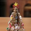 Christmas tree decoration colorful ornaments on green (green)