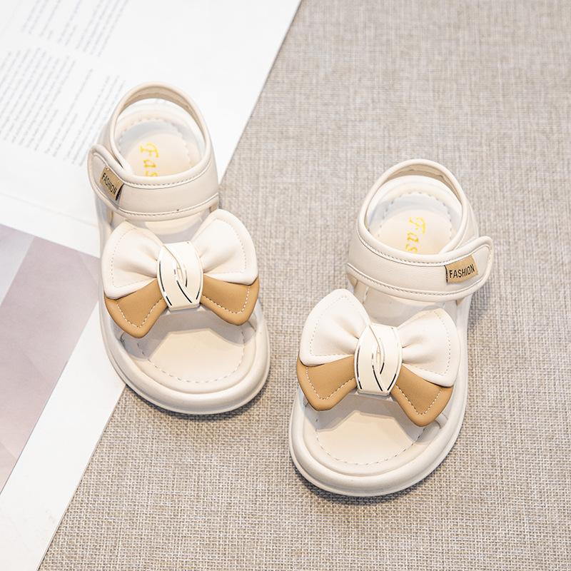 

2025 лето новая мода девочка удобная принцесса писать девочка повседневные банты сандалии письмо пляжная обувь 26-30 yards FCL mixed batch shot 50 pairs