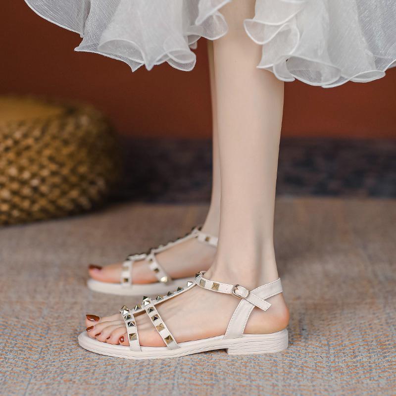 2025 summer new versatile flat-bottomed fairy style with skirt rivets Roman fashion Internet celebrity sandals women