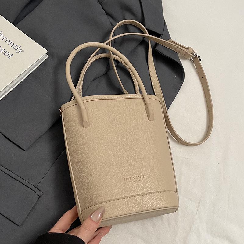 Wholesale New Products Niche Simple Solid Color Lychee Pattern Texture Hand Carry Bucket Bag Versatile Foreign Style Commuting Messenger Women's Bag