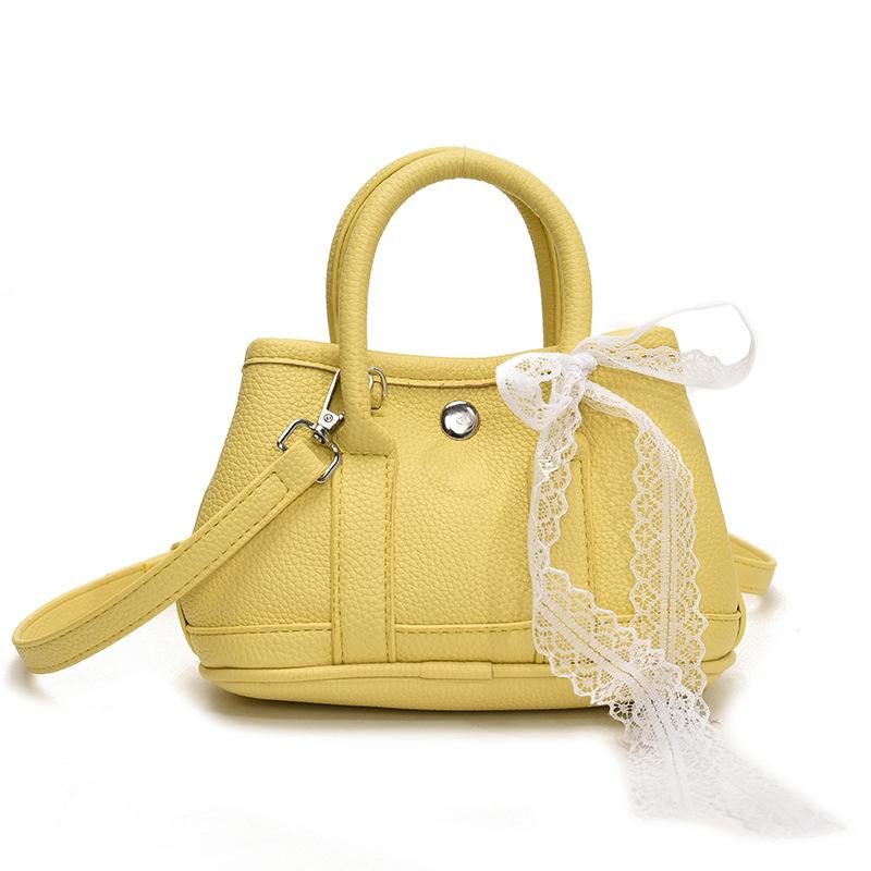 Korean fashion simple casual style portable bucket bag femininity high sense commuting versatile solid color messenger bag