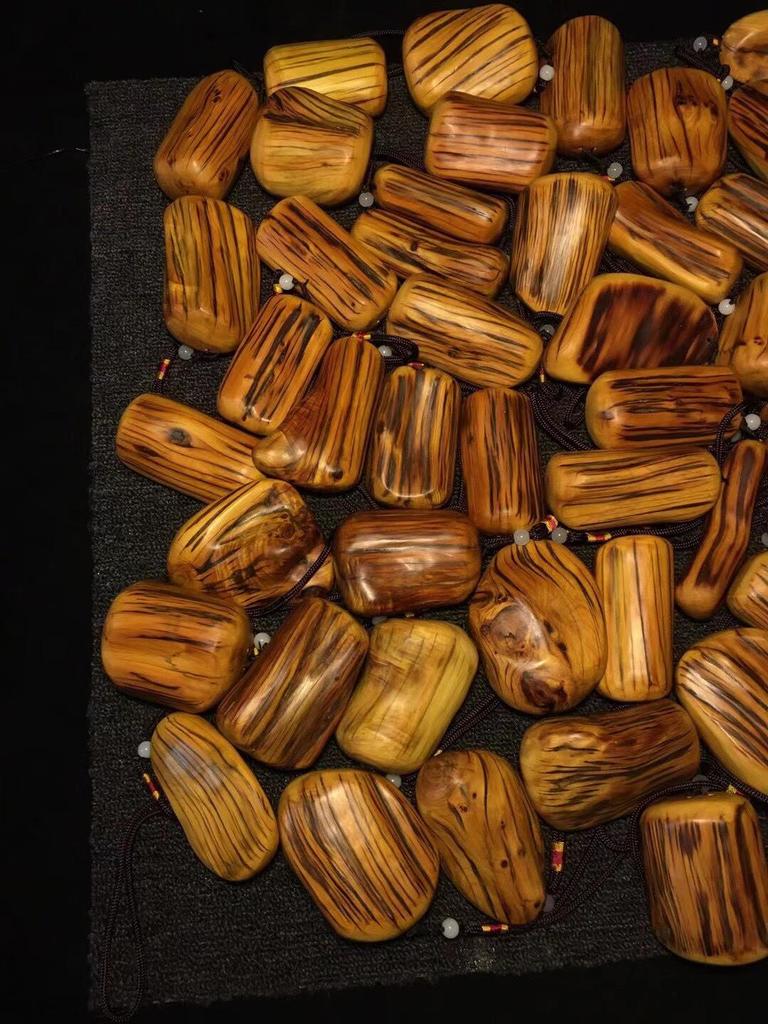 Tiger Stripe Cypress Wood Carved Pendant