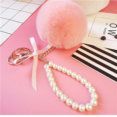 Auto Damen Handtasche Schlüsselanhänger Mode Perlenkette Kristallflasche Schleife Pompon Schlüsselanhänger Flauschiger Pompom Schlüsselanhänger Schmuck