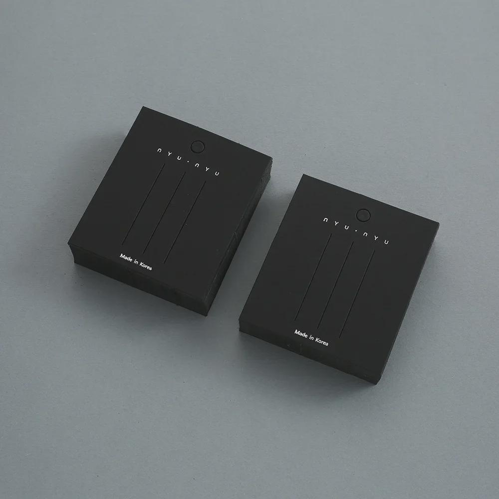 Displaykarte und Verpackung für schwarze Haaraccessoires