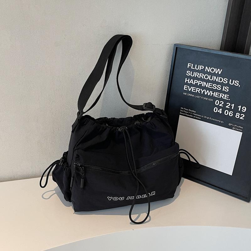 Large capacity casual tote canvas bag women's light drawstring bucket bag travel bag simple commuter shoulder crossbody bag