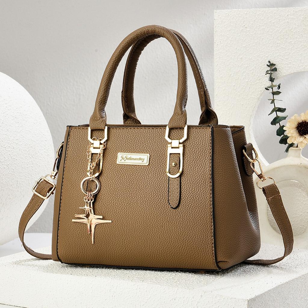 Simple and large-capacity hot-selling handheld women's bags 2026 new fashionable and versatile PU material single shoulder oblique span small
