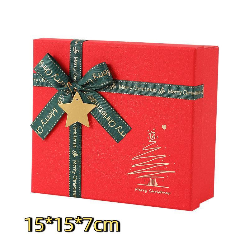 Red Christmas Gift Box With Shiny Surface Green Ribbon Gold Star Ornament Ideal For Holiday Gift Wrapping