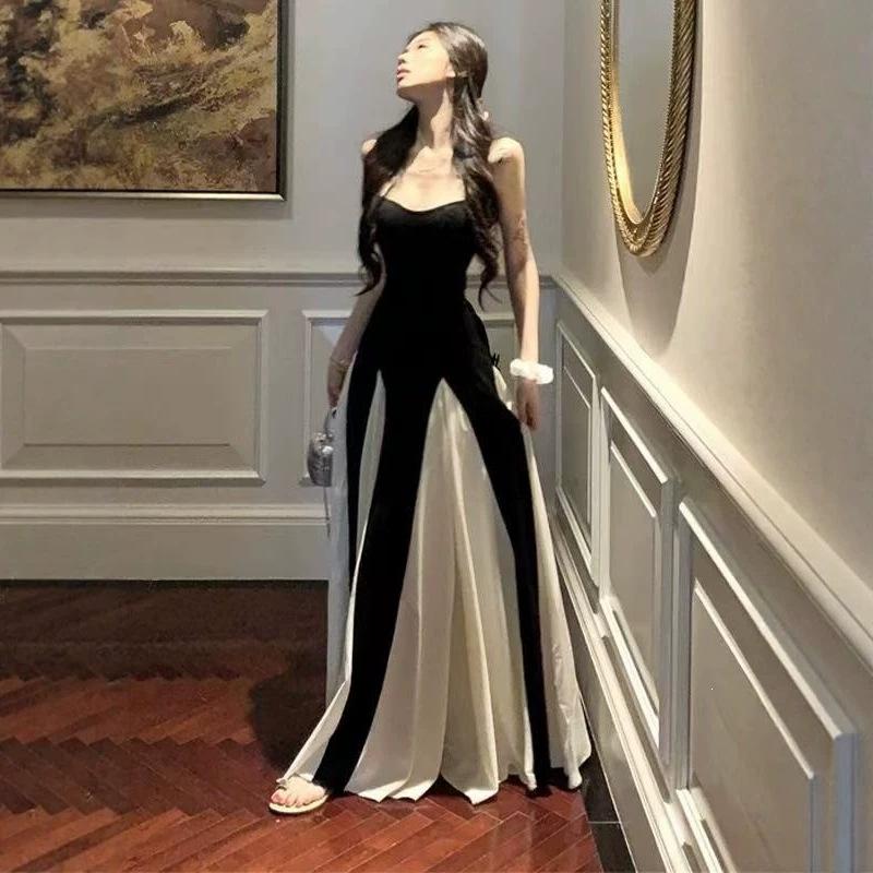 French high-end black and white splicing suspender dress Hepburn style beautiful unique temperament waist a word long dress summer
