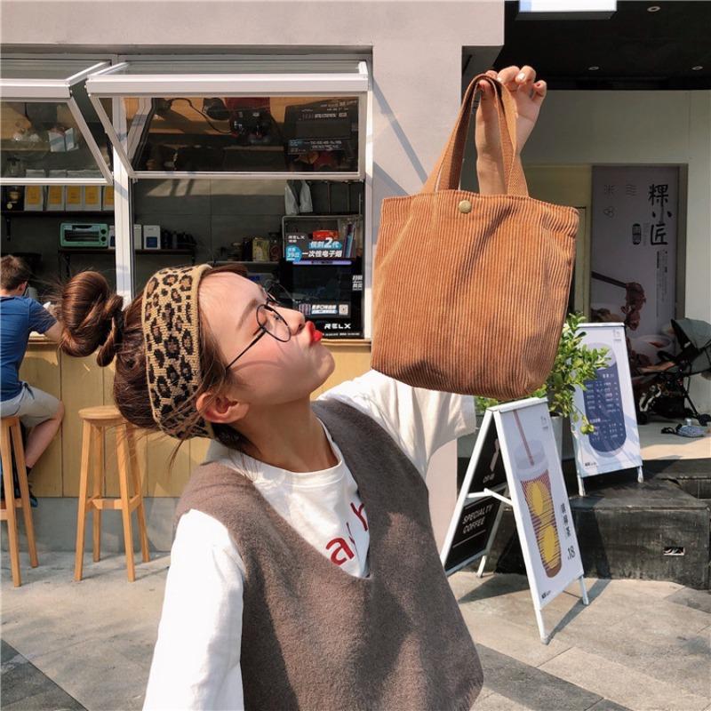 [Spot] Literary and artistic corduroy bag portable casual women's small hand bag retro cloth bag bento bag