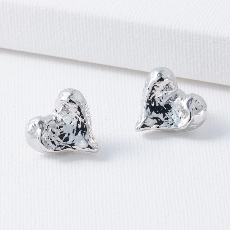 

Металеві нерегулярні сережки з ефектом лави, жіночі нішевого дизайну, що створюють відчуття високого класу та темпераменту срібний