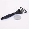A Single Pack of Plastic Mini Comb Cleaner with Embedded Bristles a Hair Removal Tool for Home Use Featuring a Handle